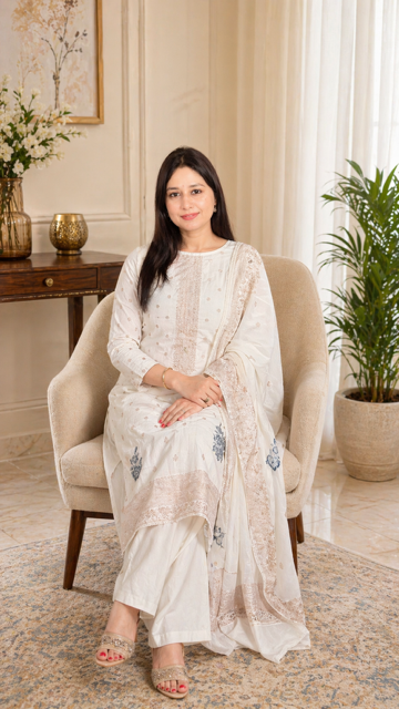 Elegant cotton suit set designed in a soothing off-white shade, exuding simplicity and timeless charm.