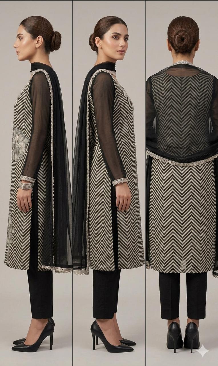 The shirt (kameez) is adorned with a continuous black and cream chevron (zigzag) print, creating a dynamic visual texture that elongates the frame.