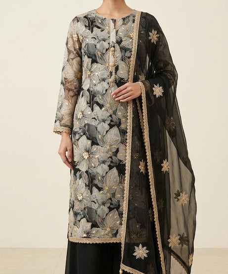 Crafted from high-quality georgette, the shirt features a large-scale, ethereal floral print in shades of charcoal, misty grey, and black