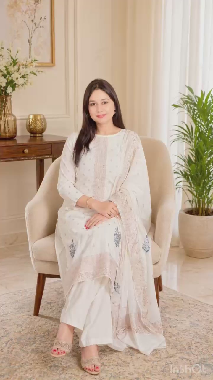 Elegant cotton suit set designed in a soothing off-white shade, exuding simplicity and timeless charm.